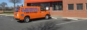 911-restoration Water-Damage-Restoration-Van-Parked-At-Commercial-Job Denver Metro